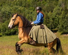 Load image into Gallery viewer, Woman riding a horse while wearing a busserull