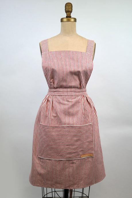 Red and white striped Hovden Wear apron. Front view.